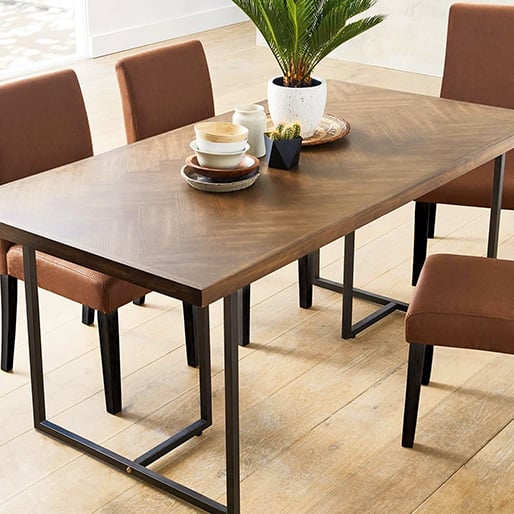 Wooden table with brown chairs