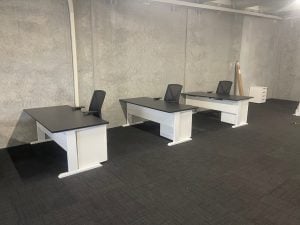 Desks with office chairs and rolling drawers in Tauranga