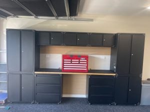 Black storage cabinets and work bench in Tauranga