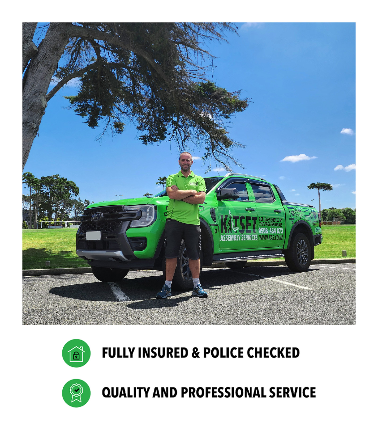NZ_MKT_FZE_BonvilleWebsiteProfileImage2_20260724_v01 Bonville standing with arms folded against a green truck in the background is a green field with blue sky.