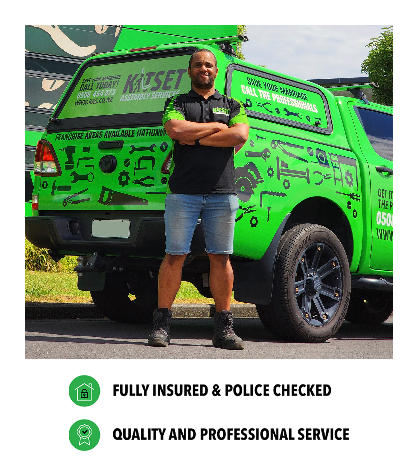 NZ_MKT_FZE_RayWebsiteProfileImage2_20260724_v01 Ray standing infront of a green vehicle and agreen building.